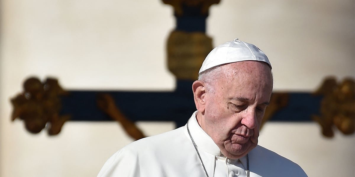 Pope Francis walks past a crucifix, during a weekly general audience at St Peters square in Vatican on November 16, 2016. — AFP