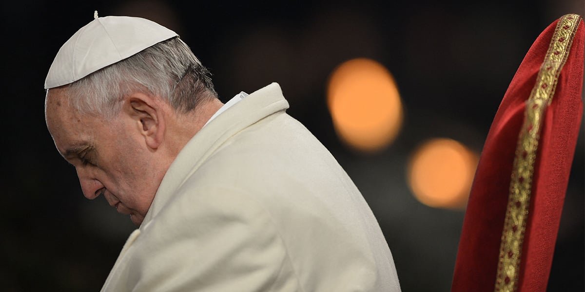 Pope Francis attends the celebration of the Way of the Cross on Good Friday at the Colosseum in Rome on March 29, 2013. — AFP