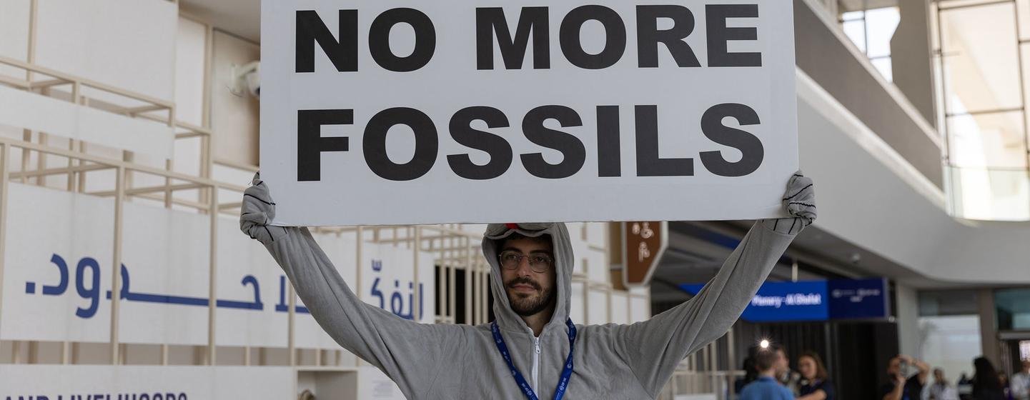 A man protests against fossil fuels at an international climate meeting in Dubai in 2023. A man protests against fossil fuels at an international climate meeting in Dubai in 2023.