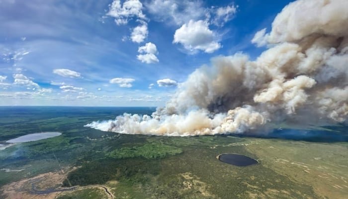 Smoke rises from wildfire SWF085 of the Red Earth East Complex, northwest of Fort McMurray, Alberta, Canada in an aerial photograph May 27, 2025. — Reuters