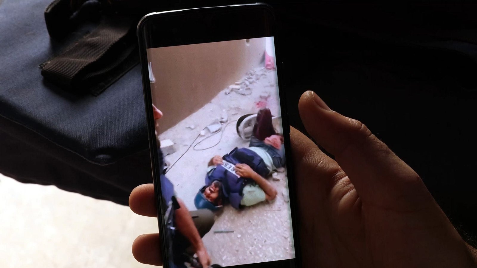 Sami Shehadeh looks at a video of the moment he was injured in Gaza in April 2024. Sami Shehadeh looks at a video of the moment he was injured in Gaza in April 2024.